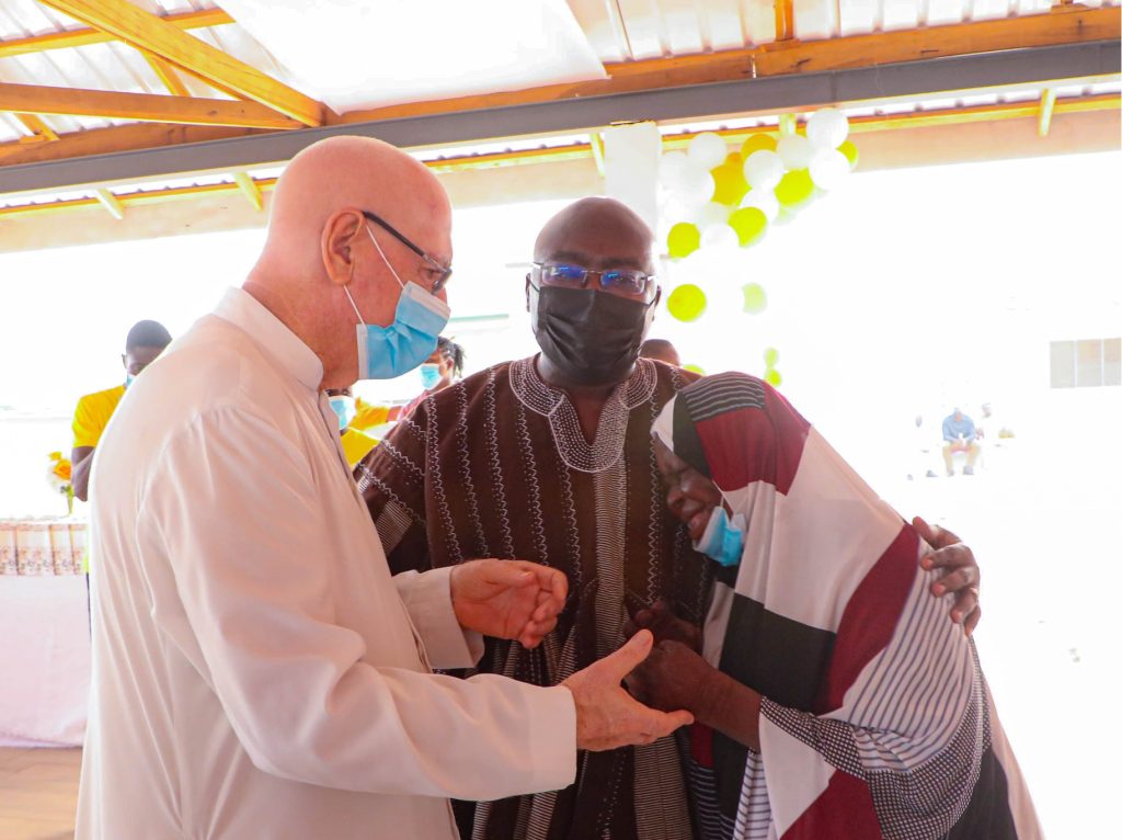 Vice President, Dr. Mahamudu Bawumia with Rev. Father Andrew Campbell and a cured leper.